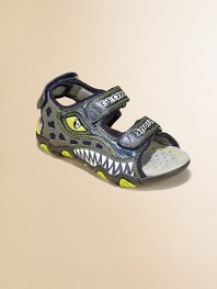 A fiery dinosaur print adorns this comfy, colorful pair of sporty sandals with double grip-tape closure.Double grip-tape closureMesh/printed synthetic upperMesh liningPadded insoleRubber soleImported