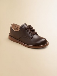The timeless choice for boys and girls, expertly crafted in durable leather with excellent support and comfort. Adjustable laces Padded insole Rubber traction sole Leather ImportedPlease note: It is recommended that you order ½ size smaller than measured. If your child measures a size 7.0, you may want to order a 6½. 