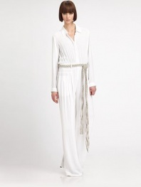 Look simply chic in this floor-sweeping minimalist jumpsuit, with a braided belt for a casual-cool effect. Shirt collarDropped shouldersLong sleeves with button cuffsButton-down front with hidden placketShirred bodiceBanded waist with belt loops and removable braided beltFront slash pocketsInseam, about 39Rise, about 11ViscoseDry cleanImportedModel shown is 5'10.5 (179cm) wearing US size 4.