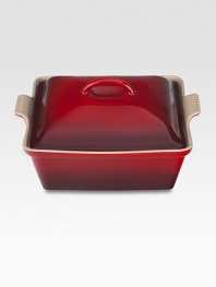 Crafted from heavy stoneware, Le Creuset cookware is the ultimate ingredient for chefs and home cooks worldwide. With its secure lid, this covered casserole is a convenient choice for transporting dishes to parties and picnics. Not only does the lid provide an effective moisture and heat lock for the dish, but it prevents spills and protects its contents.