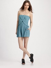 A contemporary take on the romper silhouette, finished a chic crossover overlay and flared shorts.Strapless Overlay with tulip hem Elastic waistband Concealed size zipper Inseam, about 3 79% viscose/21% nylon Dry clean Imported