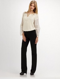 Ankle zippers add edge to this slim and luxe organic cotton pair.Side zipper Ankle zippers Waist darts Back welt pockets Inseam, about 26¾ 95% organic cotton/5% spandex Machine wash Imported Additional Information Women's Premier Designer & Contemporary Size Guide 