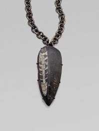 A wonder of nature, captured in smooth stone on a link chain. Orthoceras fossil in stoneGunmetal finished brass Chain length, about 20Pendant size, about 5L X 2WHook closureMade in USAPlease note: Stone size and appearance may vary.