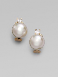 A lustrous round white pearl stud, with a sparkling cubic zirconia accent, set in 18k gold vermeil. 12mm white round organic man-made pearls Cubic zirconia 18k gold vermeil 14k gold post Post-and-hinge back Made in Spain