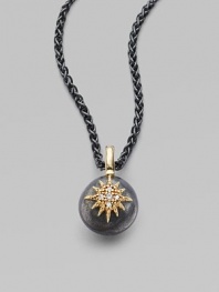 An oxidized silver ball, emboldened with a diamond-clad 14k yellow gold starburst, hangs from an oxidized silver chain.Diamonds, .05 tcw 14k yellow gold Oxidized sterling silver Length, about 17 Pendant diameter, about ½ Lobster clasp Made in USA