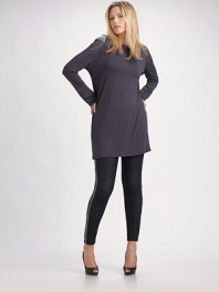 Luxe jersey knit has a hint of stretch and chic, chain-embellished shoudlers.Boatneck Long sleeves Back zipper Pullover style 97% viscose/3% spandex Dry clean Made in USA