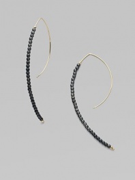 A striking modernist shape strung with oxidized sterling silver beads capped with 14k yellow gold beads.14k yellow gold Oxidized sterling silver Length, about 2¾ Pierced Made in USA