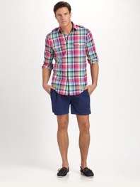 The classic Traveler swim short is rendered in sleek, quick-drying microfiber in a vibrant plaid pattern for cool, casual beach style.Elastic waistband with drawstring tie closureSide slash pocketsBack waist drainage grommetsBack flap patch pocketMesh liningInseam, about 4¾NylonMachine washImported