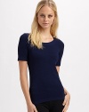 Sleek stretch knit with banded neckline and hem. Cotton/nylon/elastene Machine wash or dry clean Imported