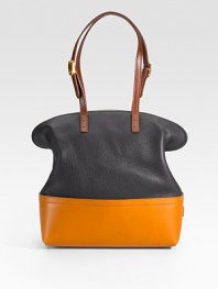 A slouchy and curvaceous carryall reimagined with modern color blocking, in an array of smooth and pebbled leathers.Adjustable shoulder straps, 7-9½ drop Top zip closure Two inside open pockets Center zip compartment Linen lining 12W X 13½H X 5D Made in Italy