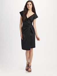 The classic little black dress is elevated in stretch satin with a fresh tulip skirt.Pleated crossover bodice Draped asymmetrical skirt Invisible back zip closure Darts at back waist About 25½ from natural waist 65% acetate/32% nylon/3% spandex 100% polyester lining Dry clean Imported