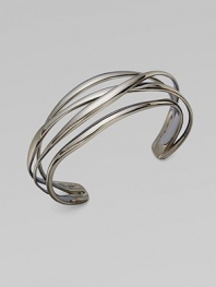 Slender, polished bands have a liquid look as they gracefully crisscross one another in this lovely open cuff.Ruthenium platedDiameter, about 2¼Width, about ¾Imported