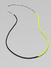 A trio of contrasting colors make this a stand-out piece. Glass and acrylic beadsLength, about 43Slip-on styleImported 