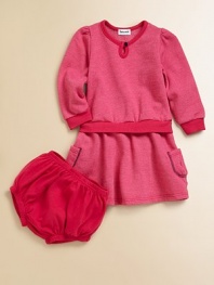 Soft brushed fleece dress has the look of a sweatshirt-and-skirt, with coordinating jersey bloomers.Long sleeve pullover Rib knit trim at crewneck, cuffs and waist Patch pockets Bloomers with elasticized waist and leg openings 50% cotton/50% modal Machine wash Made in USA
