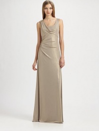 Fluid metallic jersey, in an artfully draped, floor-length style accented with a beaded shoulder detail.ScoopneckShoulder drape with beaded detailSleevelessEmpire seamSide gathers at waistBack cutout with gathered drapeAbout 42 from natural waist95% polyester/5% spandexDry cleanMade in USA of imported fabricModel shown is 5'10 (177cm) wearing US size 4. 