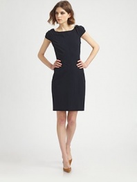 The classic LBD finished with body-con seams and a subtle, skin-baring back V.Boatneck Cap sleeves Contour seams at bodice Back V Center back zipper About 20 from natural waist 71% viscose/23% polyamide/6% elastane Dry clean Imported