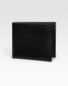 Saffiano leather wallet opens to eight credit card slots and two billfold compartments. Embossed Prada logo detail 4¼W X 3¾H Made in Italy 