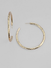 Simple hoops become simply sensational when crafted with a rich hammered texture. 18k yellow gold Diameter, about 2 Post back Imported