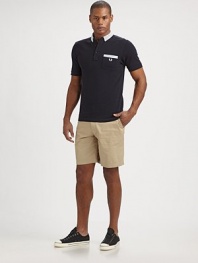 A classic cotton polo with a front patch pocket and seersucker trim. Three-button placketFront patch pocketEmbroidered signature logo on chestCottonMachine washImported