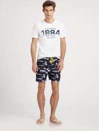Classic, camo print adorns these swim trunks shaped in quick-drying nylon, with a drawstring waist for an easy-fit.Drawstring tie waistSide cargo pocketInseam, about 9NylonMachine washImported