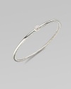 A slender bangle of twisted sterling silver cable is topped by a delicate oval of pavé diamonds. Diamonds, 0.07 tcw Sterling silver Diameter, about 2¼ Imported
