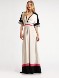 An elegant maxi silhouette, finished with bold colorblocking and snake-print details.V necklineDropped shouldersDolman sleevesPleating at bodiceMock beltGathered skirtConcealed side zipperAbout 64 from shoulder to hemPolyesterDry cleanImported