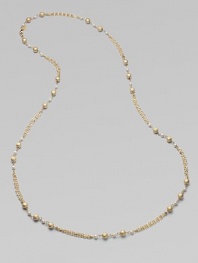 Strands of delicate golden chains gracefully connect textured golden beads and lustrous glass pearls in this elegant design that's long enough to double.Glass pearlsBrassLength, about 42Lobster claspImported
