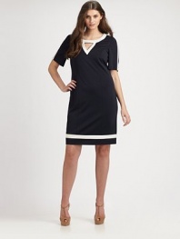 Thanks to clever tailoring, namely Princess seams and athletic-inspired, contrast stripes, this sophisticated silhouette can also be an everyday staple. Round neckCutout detail on necklineElbow-length sleevesPrincess seamsContrast trimBack zipperFully linedAbout 24 from natural waist65% rayon/30% nylon/5% spandexDry cleanMade in Italy