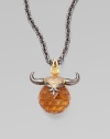 A goldplated and black rhodium plated sterling silver bull horns, complete with pavé cubic zirconia, looms over a topaz crystal, strung on a long elegant chain.Topaz crystal Cubic zirconia Goldplated sterling silver Black rhodium plated sterling silver Chain length, about 30 Pendant width, about 1½ Lobster clasp Imported