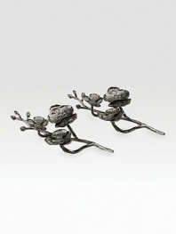 Inspired by the intricacies of natural forms, this graceful design of intertwined branches and flowers is richly detailed in cast metal. From the Black Orchid CollectionSet of 28¼ longBlackened nickel-plateHand washImported