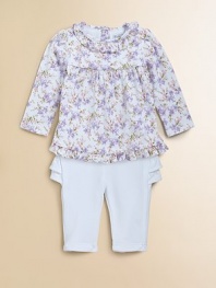 A whimsical floral print lends cute, sweet style to a girlie cotton tunic, paired perfectly with ruffled pants.Ruffled crewneckLong sleevesBack buttonsElastic waistband Pleated yokeRuffled hemElastic waistbandCottonMachine washImported Please note: Number of buttons/snaps may vary depending on size ordered 