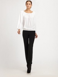 This ultra-flattering blouson style can be worn on or off the shoulder, thanks to an adjustable drawstring neckline.Drawstring portrait neckline with front self tieLong blouson sleeves with gathered cuffsSmocked, elastic hemlineViscoseDry cleanImported of Italian fabricModel shown is 5'11 (180cm) wearing US size 4. 