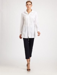 Crisp woven cotton, tailored in a flattering silhouette featuring delicate front pleats.Point collarButton frontPleated frontLong sleeves with button cuffsAbout 29 from shoulder to hem83% cotton/14% polyamide/3% elastaneDry cleanMade in Italy of imported fabric Model shown is 5'11 (180cm) wearing US size 4.OUR FIT MODEL RECOMMENDS ordering true size. 