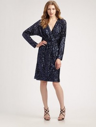 Shimmery allover sequins add festivity to this standout design.V surplice neckline Long sleeves Concealed back zip Fully lined About 22 from natural waist Polyester Dry clean ImportedModel shown is 5'9 (175cm) wearing US size 4. 