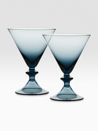A stirring pair of martini glasses designed with fabulous color and a dramatic silhouette inspired by city skylines. From the High Rise Collection Set of 2 6 oz. capacity 5¼ high Dishwasher safe Imported 
