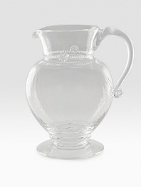 A simply stunning glass pitcher marries a traditional silhouette with a spiraled sphere ground. Extraordinary thread and berry detail creates all the interest and charm of an heirloom classic. 76 oz. capacity 9½H X 7½ diam. Dishwasher safe Imported 