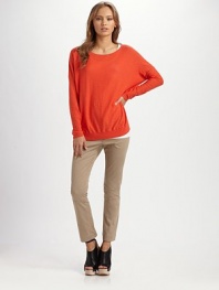 Slouchy cotton boatneck with dropped shoulders and a split hem. BoatneckDropped shouldersLong sleevesSplit hemCottonDry cleanImported