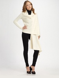 Subtly draped Italian wool and cashmere with cable-knit construction that exudes modern elegance. Draped open frontLong dolman sleevesRibbed cuffs and hemAsymmetrical cropped back hem80% wool/20% cashmereDry cleanImported of Italian fabric