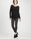 Dolman sleeves and a sleek boatneck complement wool-rich, semi-sheer crochet knit. Boatneck Long dolman sleeves Semi-sheer crochet Longer length hits below the hips 90% wool/10% nylon Dry clean Imported of Italian fabric
