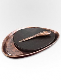 A smooth, rounded pebble shape with the distinctive beauty of bronze-finish alloy and wood creates the ultimate hostess or wedding gift. From the Heritage Pebble CollectionIncludes cheese knifeAntique copper-plated alloy15W x 11LHand washImported