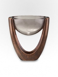 Forget the coaster or trivet: this ingenious design features a bronze-finish alloy structure that holds a glass bowl in mid-air suspension. From the Heritage Pebble CollectionAntique copper-plated alloy with glass plates11W X 6 H X 12DHand wash Imported