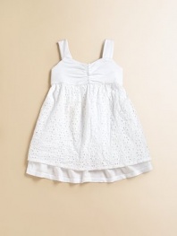 An eyelet overlay and gathered sweetheart neckline make this simple frock simply outstanding.Sweetheart necklineWide strapsBack buttonsEmpire waistFull skirtCottonMachine washMade in USA Please note: Number of buttons may vary depending on size ordered. 