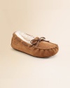 Suede moccasins fully lined in sheepskin to keep little toes nice and warm. Leather laces Embossed UGG logo Molded rubber sole Moisture-wicking sheepskin insole Imported