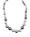 Glass act. Glass pearls in silvery gray hues adorn this classically chic collar necklace from Givenchy. Set in silver tone mixed metal, it's an elegant finishing touch for your workday wardrobe. Approximate length: 16 inches + 2-inch extender.