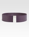 A supple leather design detailed in chic perforations and a logo engraved, metal buckle. Width, about 2¼Imported 