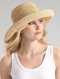 Packable wide brim style is hand-crocheted of natural raffia with an adjustable sizing cord. About 4 brim One size fits most Imported