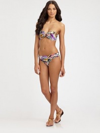 A vivacious design featuring an intoxicating butterfly print, complemented exquisitely by flattering, ruched sides.Fold-over waistbandRuched sidesModerate coverageFully lined85% polyamide/15% spandexHand washImported Please note: Bikini top sold separately. 