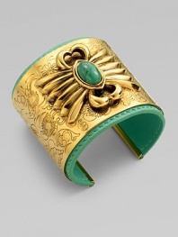 EXCLUSIVELY AT SAKS.COM. A striking relief design with a colorful turquoise stone is the centerpiece of a wide, delicately etched golden cuff layered over a bright leather interior.TurquoiseLeatherGoldplatedDiameter, about 2¼Width, about 2Made in France