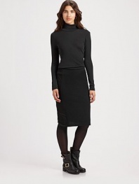 Rich wool knit hugs the body in a sleek pencil silhouette.High banded waistSide panelsCenter back zipperVented hemAbout 22 longWoolDry cleanImported