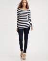 Bold sailor stripes lend graphic appeal to this sleek stretch knit.Contrast boatneck with button detailsLong sleevesShirrtail hemPullover styleAbout 26 from shoulder to hem96% rayon/4% spandexDry cleanMade in USAModel shown is 5'9 (175cm) wearing US size Small.